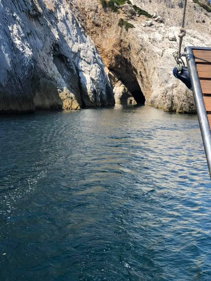 Sailing close to the rocks and a sea cave