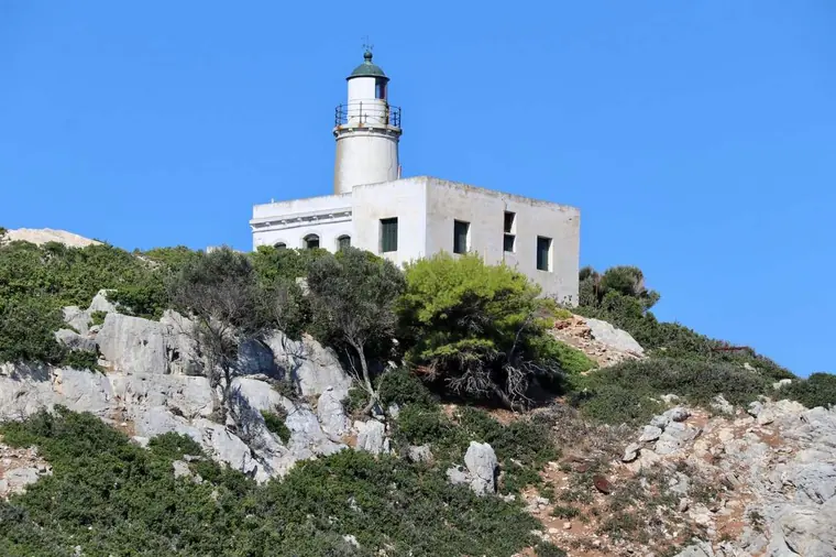 The lighthouse on the rocky headland