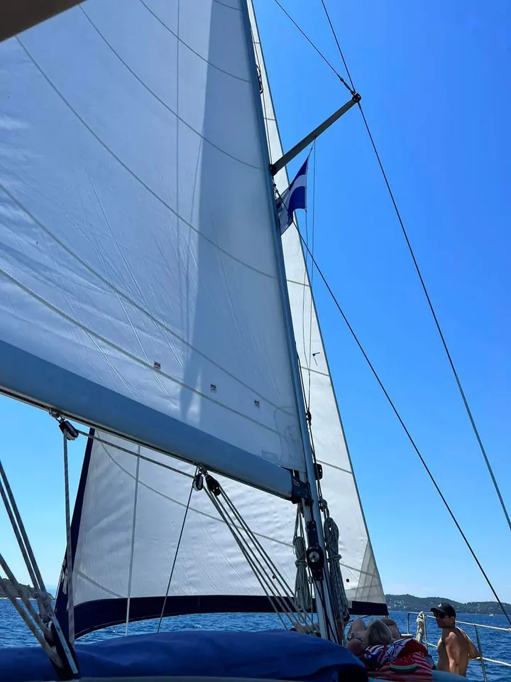 The mainsail against the blue sky