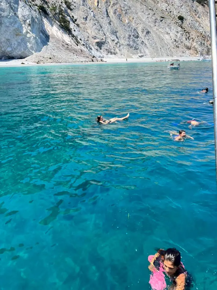 Swimming in a turquoise cove under white cliffs
